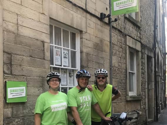 Rachel Holley and Tony Halsall arrive in Lancaster with another rider