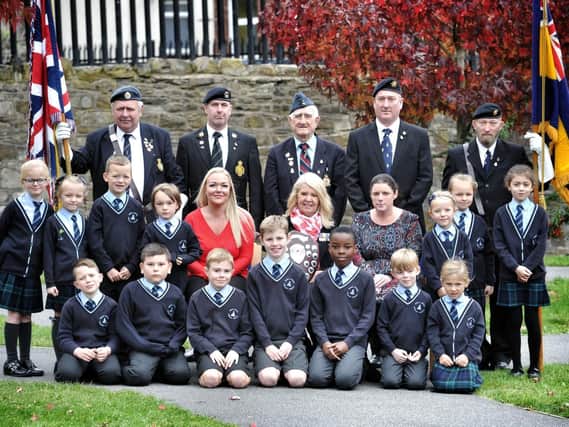 Relatives of Sgt Steven Darbyshire and Lt Cdr Ian Molyneux with Royal British Legion members and children from Mabs Cross Primary School