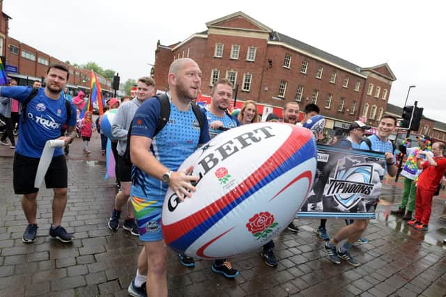 Rain fails to dampen spirits as town celebrates Wigan Pride