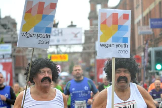 Bernard Edmunds (right) in fancy dress with friend and Youth Zone co-founder Martin Ainscough at the 2017 Wigan 10K