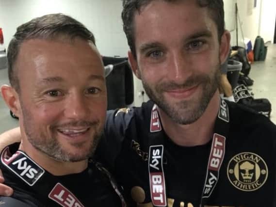Noel Hunt (left) celebrates the League One title success with Will Grigg at Doncaster