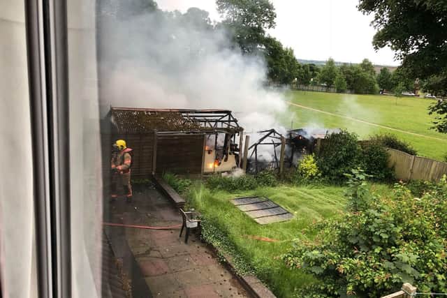 Firefighters tackle the shed fire at the Shevington home