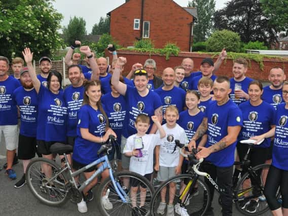 Olly Johnson, seven, surrounded by friends and family forming Olly's Army