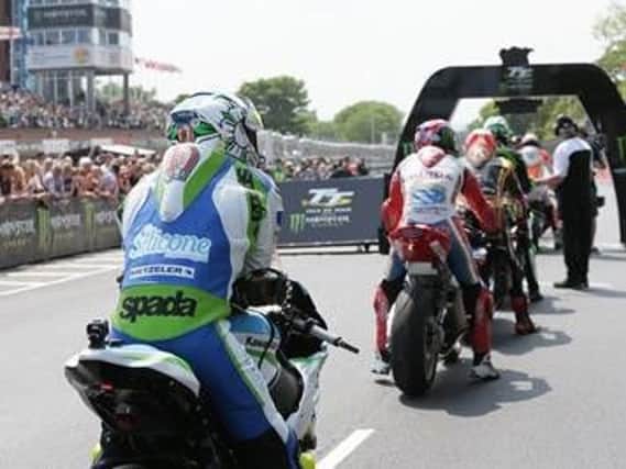 Riders line-up at the start line on Monday at the Isle of Man TT. Picture www.iomtt.com