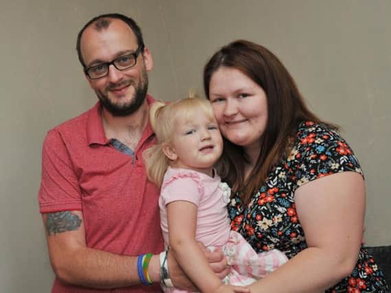Evana Parkinson with her parents Scott and Kayley