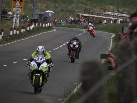 Rob Hodson (44) leads the charge through The Bungalow section of the Isle of Man TT Course on Friday