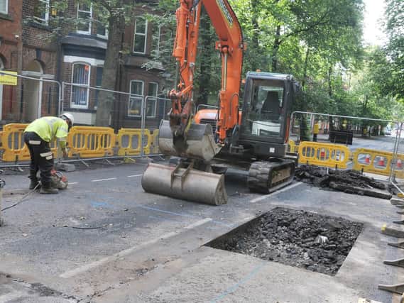 A section of Bridgeman Terrace, Wigan, is closed as workmen fix a collapsed sewer in the road