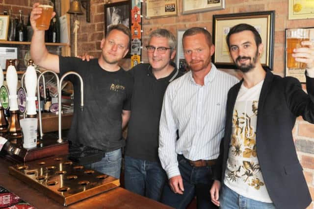 Head brewer Jonathan Provost, left, and director Martin Blythe, second from right, at Wigan Brewhouse, welcome Benoit Durand head brewer in Wigan's twin town Angers and Angers ambassador Martin Pouvreau, right, as they have created a special beer celebrating the 30th anniversary of the twinning