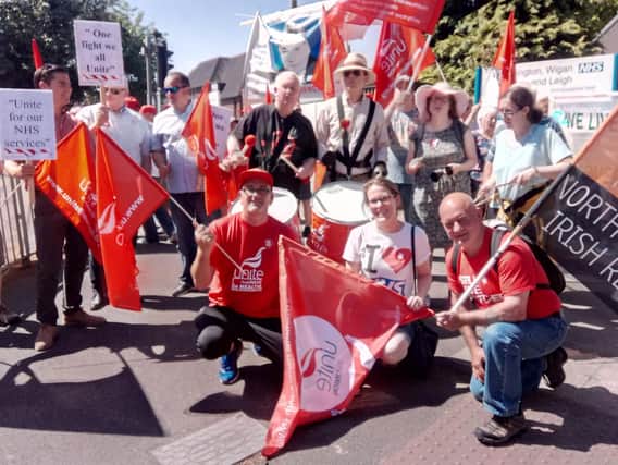 Campaigners from Unite join the picket line outside Wigan Infirmary