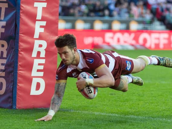 Oliver Gildart crosses for a try against Salford in Wigans last appearance at the DW Stadium  back on May 6