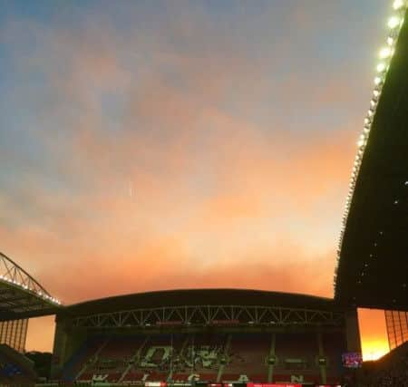 The Rivington blaze as seen by fans arriving for last night's match at the DW. Picture by Anthony Fairhurst