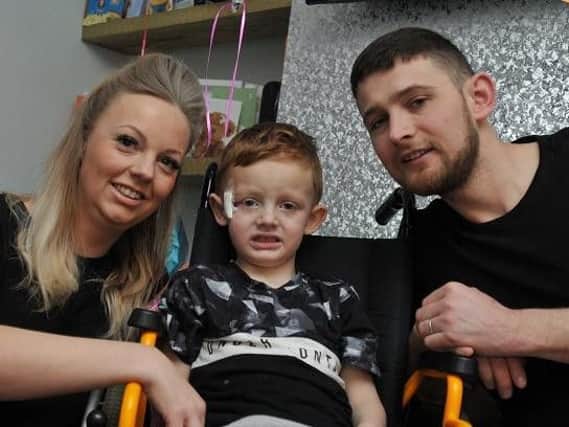 Brave little Archie Musgrave with parents Kate and Joe