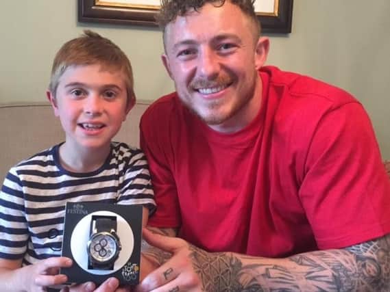 Jack and Josh with the watch donated as a prize for fund-raisers