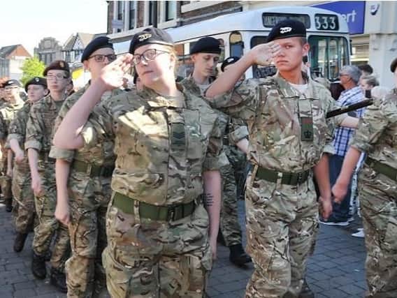 Military personnel take part in the march
