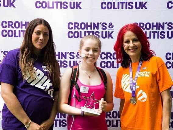 Ellie Pugh, 13, centre,with Crohns and Colitis UK ambassador Carrie Grant, right