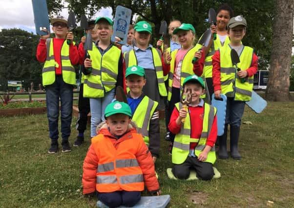 Children from St David Haigh and Aspull CE Primary School  help with Borough in Bloom planting at Haigh Woodland Park