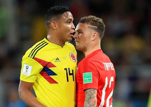 Columbia's Luis Muriel (left) and Kieran Trippier exchange words