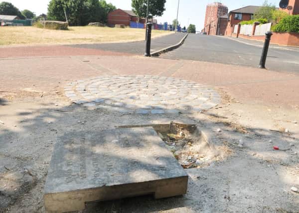 The concrete slab that has been moved from its original spot andf time capsules stolen that placed under it in 1995 by pupils