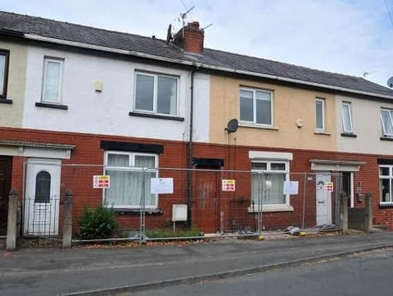 Exterior of 18 and 20 Wallace Lane, Whelley, Wigan - the two terraced houses are to be demolished because they have been built either side of a mine shaft