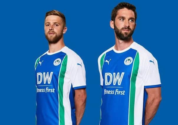 Michael Jacobs and Will Grigg sporting the new Latics home kit