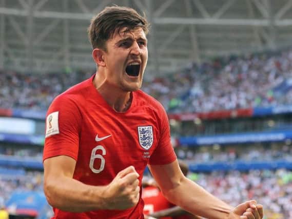 England defender Harry Maguire celebrates his goal against Sweden