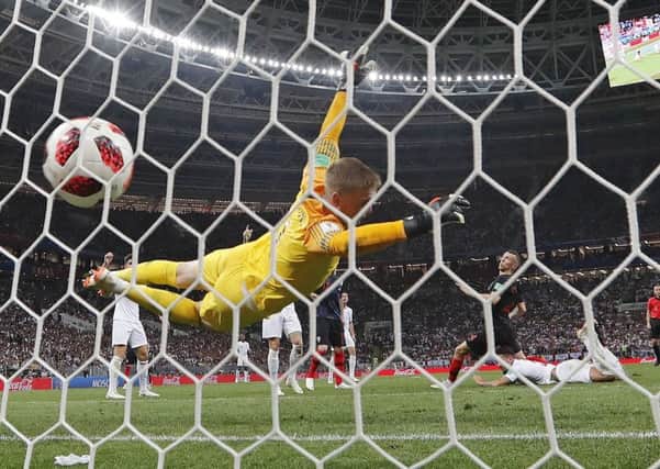 Croatia's Ivan Perisic scores his side's first goal beating England keeper Jordan Pickford