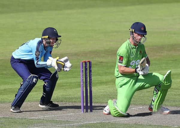 Lancashire's Dane Vilas flicks the ball past Yorkshire wicketkeeper Jonathan Tattersall during the One Day Cup North Group match at  Old Trafford in June