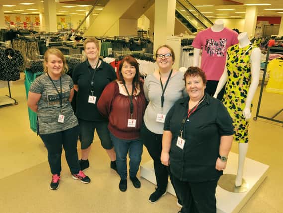 Staff, from left, Kelly McMahon, Beth Searle, Tracey Wilcock, Laura McMahon and Jeanette McMahon, get ready for The 1 Store opening on Friday, in the former TK Maxx unit, upstairs in the Grand Arcade shopping centre, Wigan