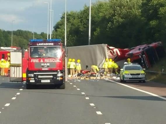 The M6 has been closed after a lorry overturned