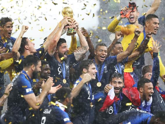 France celebrate with the trophy after winning the FIFA World Cup Final at the Luzhniki Stadium, Moscow