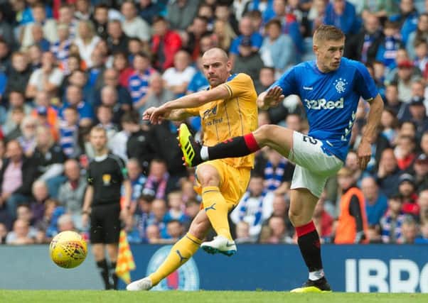 Darron Gibson in action for Wigan Athletic at Rangers
