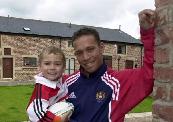 Adrian Lam and son Lachlan feeling at home in Wigan during his stint as a player