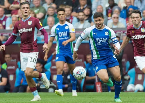 Sam Morsy does battle with Jack Grealish and the rest of the Aston Villa midfield