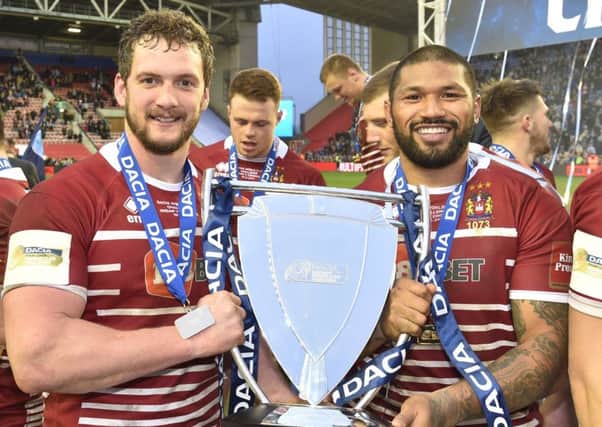 Frank Paul Nuuausala lifts the World Club Challenge with captain Sean O'Loughlin