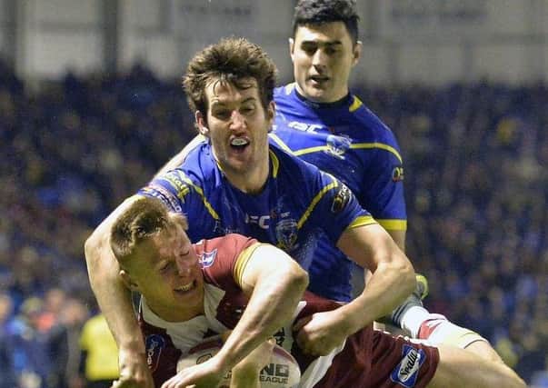 Stefan Ratchford tackles Tom Davies
