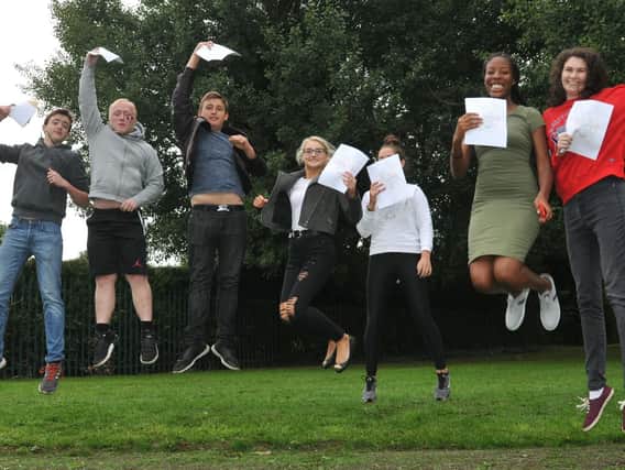 Students jump for joy at Shevington High School after getting their GCSE results