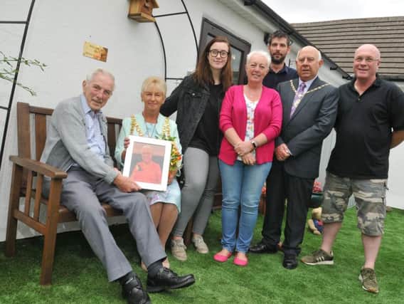Coun Greensmith opens the Housley Garden, seen here with Wilf holding a picture of wife Brenda