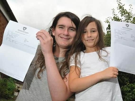 Thomas (left) and Ellie with their certificates
