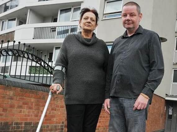 Jackie Prescott and Andy Hall, residents of Brook House flats, are unhappy with the maintenance and security