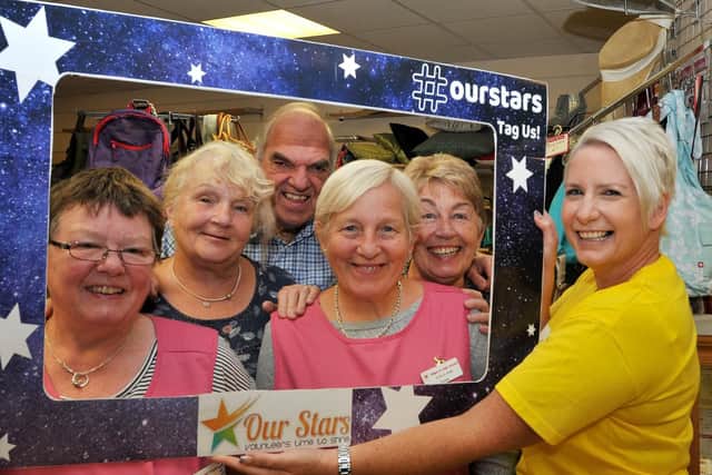 Volunteers at the Hindley branch of the Wigan and Leigh Hospice Shop are put in the frame for the Our Stars celebrations by Communities Officer Liz Ramsden