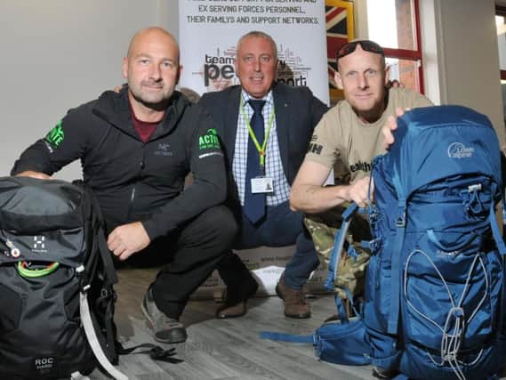 John Ingham, from Activate, and Mark Kelly, from Healthier Heroes, get ready to climb Toubkal, with support from Wigan Councils John Harker, centre
