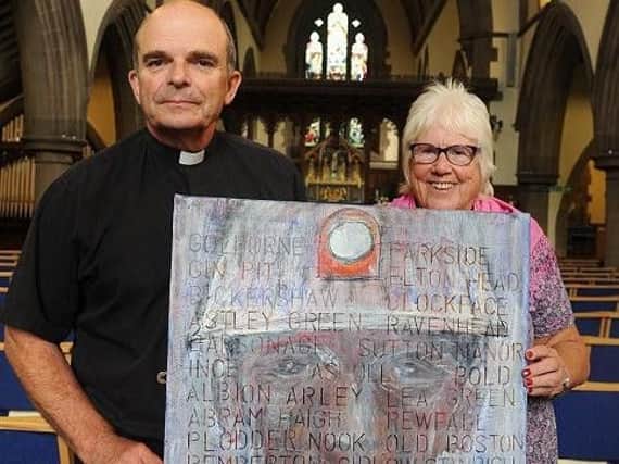Reverend Stan Higginson and Sheila Ramsdale with artwork inspired by mining in the borough