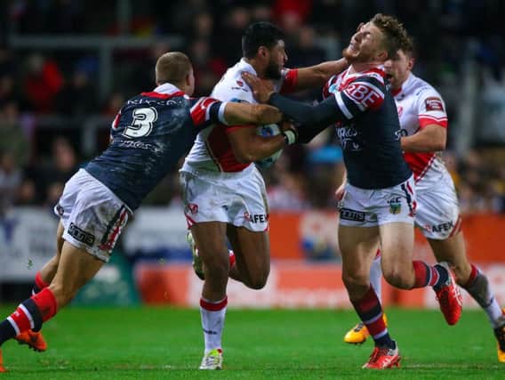 Jackson Hastings (right) in  action for Sydney Roosters against St Helens in 2016s World Club Challenge