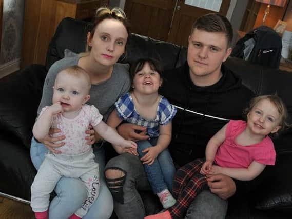 Pregnant Rebecca Asquith and partner Ross Ashton with 10-month-old Lola, Ava, three, and Isabella, two