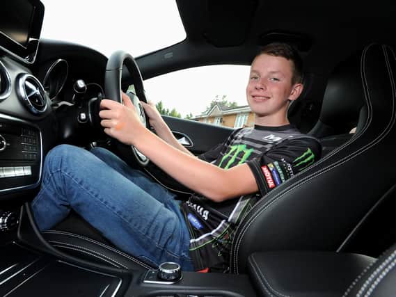 Jack is already comfortable at the wheel