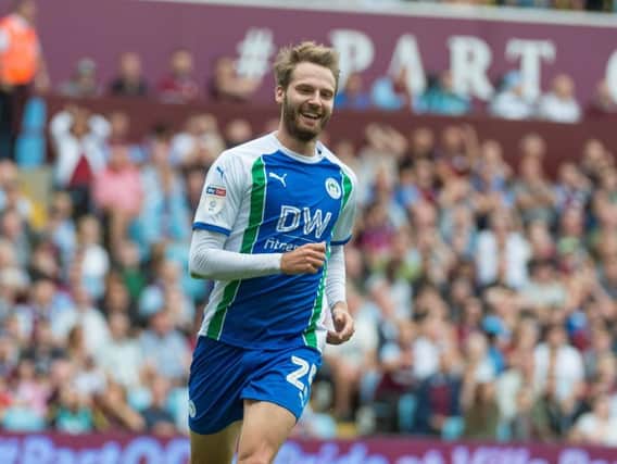 Nick Powell marked his 100th league appearance for Wigan Athletic with a goal