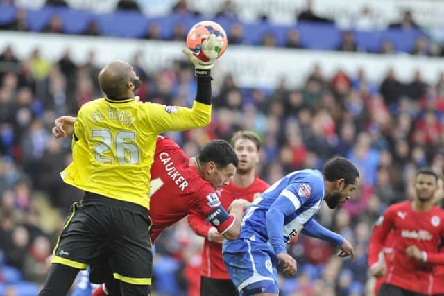 Steven Caulker playing against Latics for Cardiff in 2013-14