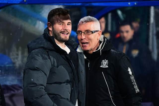 Zak Hardaker (left) watches Wigan take on Huddersfield Giants at the John Smith's Stadium with the club doctor, Dr Chris Brookes