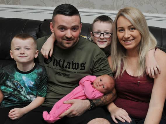 John and Sam Billington from Golborne, with baby Sophia, she was born in the bathroom at their home, pictured with sons Thomas, four, left, and James, seven, centre