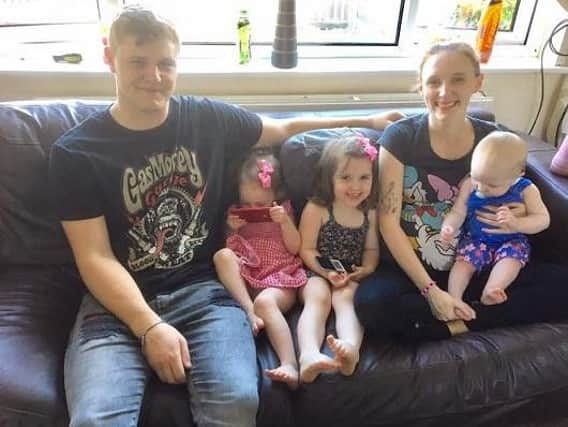 Pregnant Rebecca Asquith and partner Ross Ashton with children, 10-month-old Lola, left, Ava, three, and Isabella, two, right, are back home in their rat-free house after council workers worked to rid it of an infestation